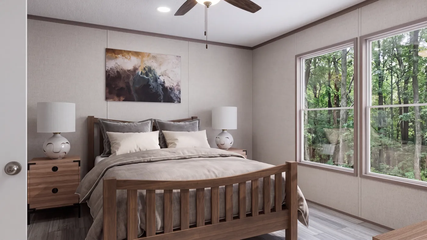 The THE MOUNTAINEER 60 Primary Bedroom. This Manufactured Mobile Home features 3 bedrooms and 2 baths.