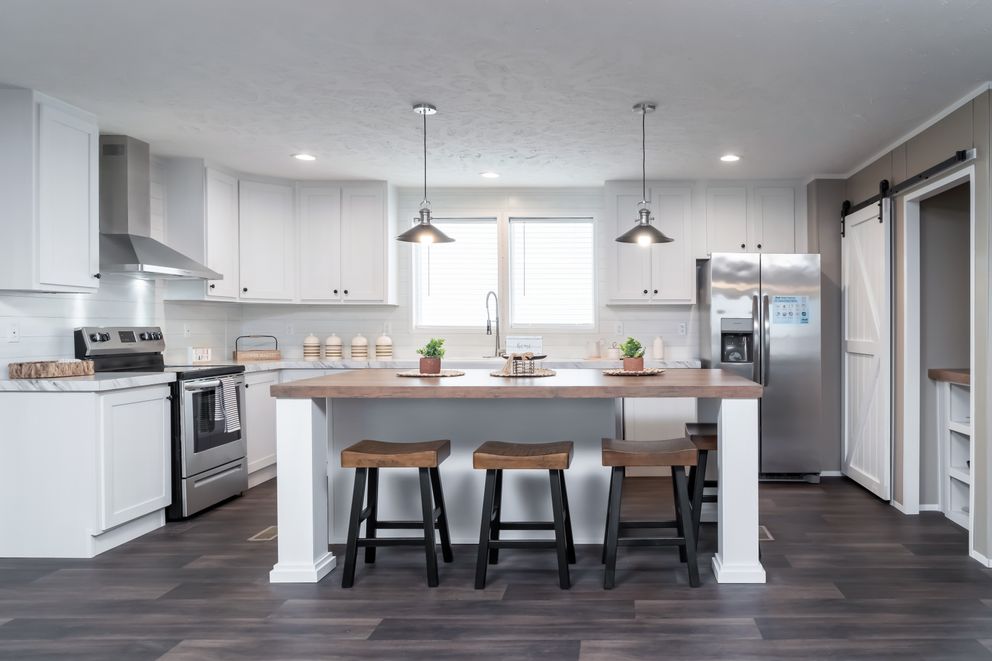 The ISLAND BREEZE 64 Kitchen. This Manufactured Mobile Home features 4 bedrooms and 2 baths.