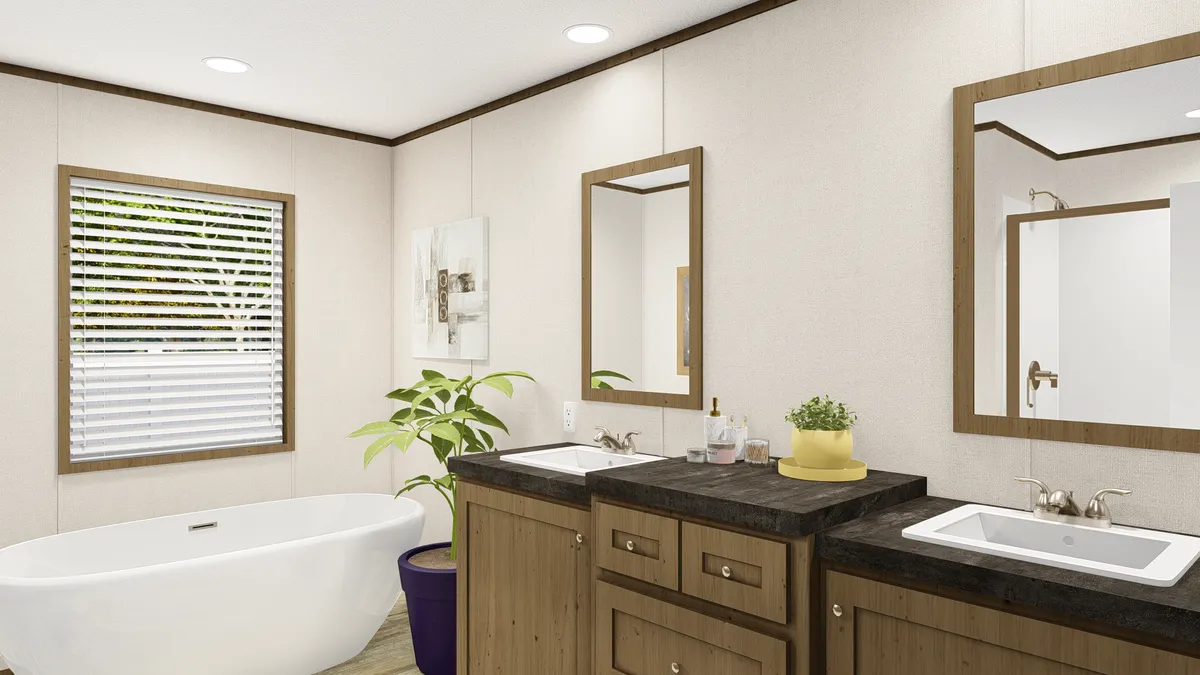 The GRAND LIVING 64 Primary Bathroom. This Manufactured Mobile Home features 3 bedrooms and 2 baths.