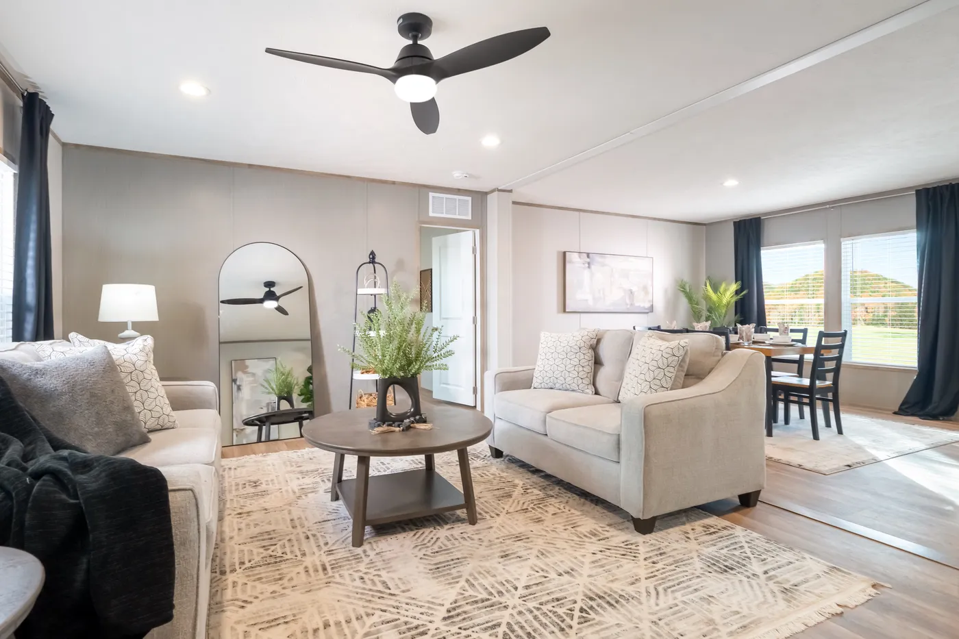 The ECLIPSE Living Room. This Manufactured Mobile Home features 4 bedrooms and 2 baths.