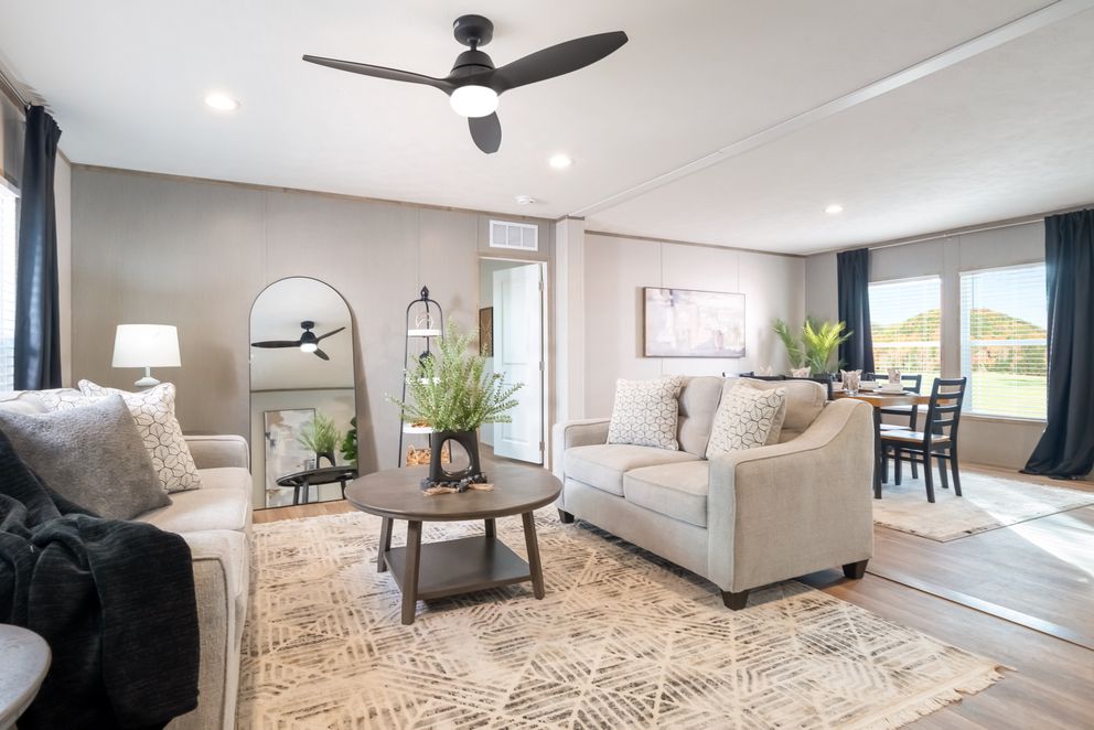 The ECLIPSE Living Room. This Manufactured Mobile Home features 4 bedrooms and 2 baths.