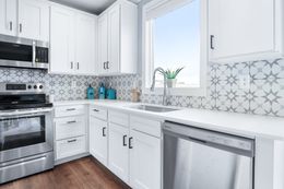 The THE ATLAS Kitchen. This Manufactured Mobile Home features 4 bedrooms and 3 baths.