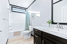 The THE LOUIS Guest Bathroom. This Manufactured Mobile Home features 4 bedrooms and 3 baths.