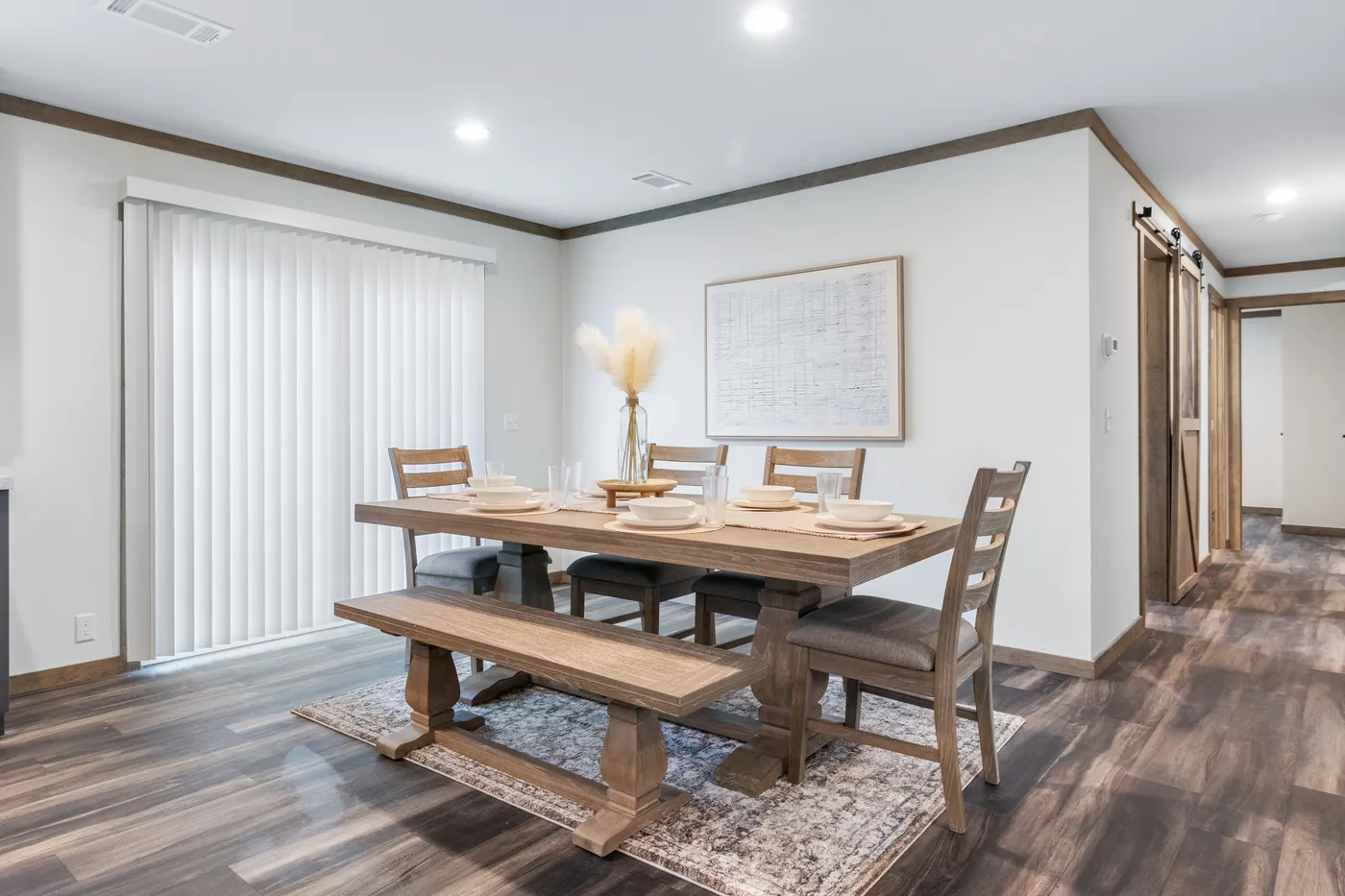 The EVERETT ELITE Dining Room. This Manufactured Mobile Home features 4 bedrooms and 3 baths.