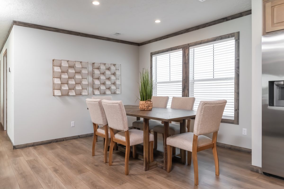 The THE JACKSON Dining Room. This Manufactured Mobile Home features 4 bedrooms and 2 baths.