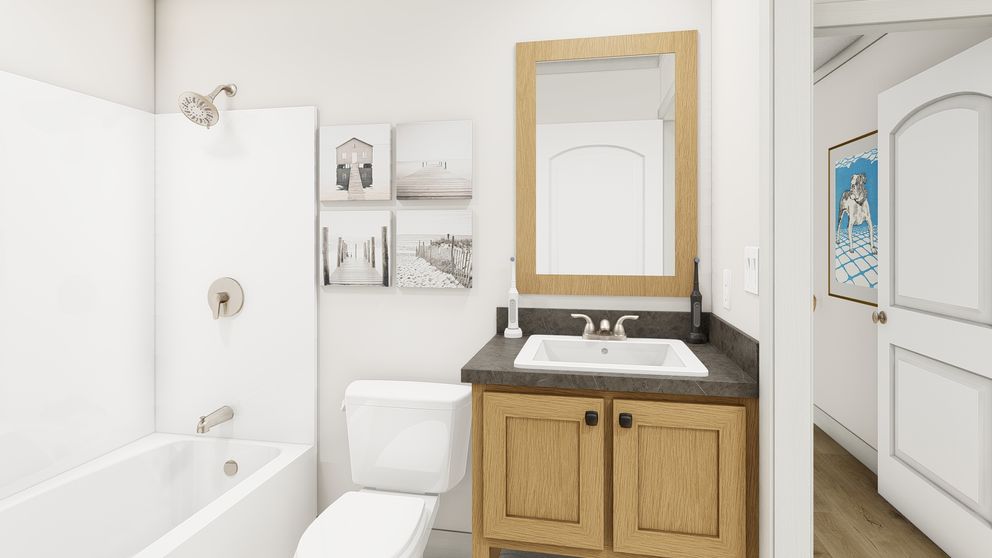 The SWEET CAROLINE Guest Bathroom. This Manufactured Mobile Home features 3 bedrooms and 2 baths.