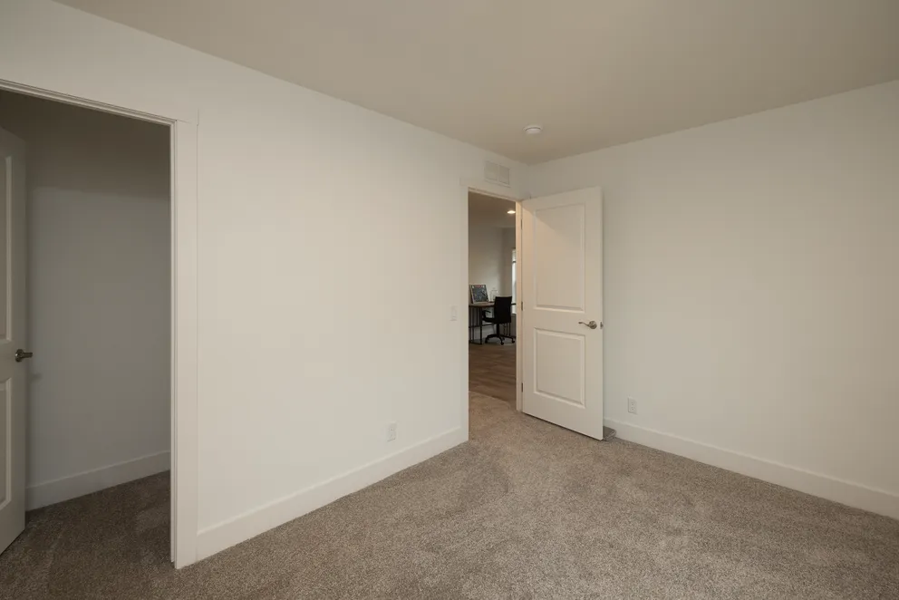 The HEY JUDE Bedroom. This Manufactured Mobile Home features 4 bedrooms and 2 baths.