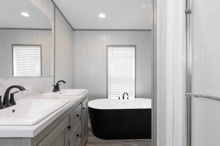 The THE ANNIVERSARY 76 Primary Bathroom. This Manufactured Mobile Home features 3 bedrooms and 2 baths.