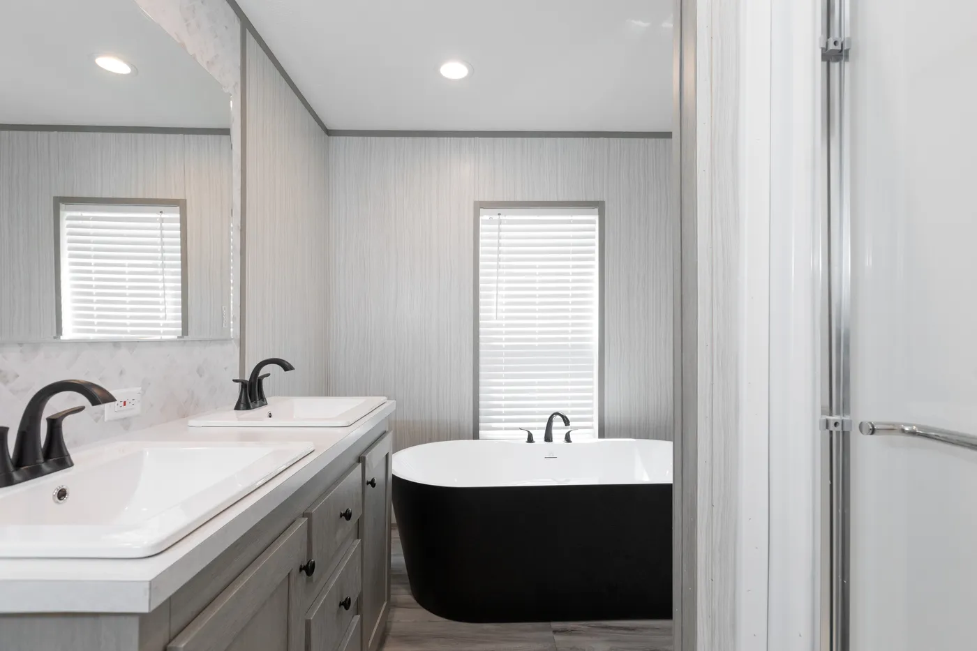 The THE ANNIVERSARY 76 Primary Bathroom. This Manufactured Mobile Home features 3 bedrooms and 2 baths.