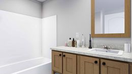The LOVELY DAY Guest Bathroom. This Manufactured Mobile Home features 4 bedrooms and 2 baths.