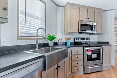 The RESOLUTION 16763J Kitchen. This Manufactured Mobile Home features 3 bedrooms and 2 baths.