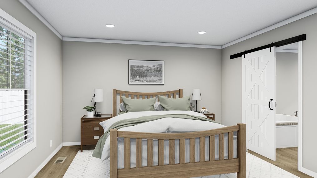 The THE FRANKLIN Primary Bedroom. This Manufactured Mobile Home features 3 bedrooms and 2 baths.