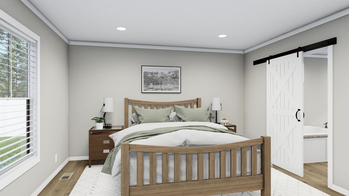 The THE FRANKLIN Primary Bedroom. This Manufactured Mobile Home features 3 bedrooms and 2 baths.
