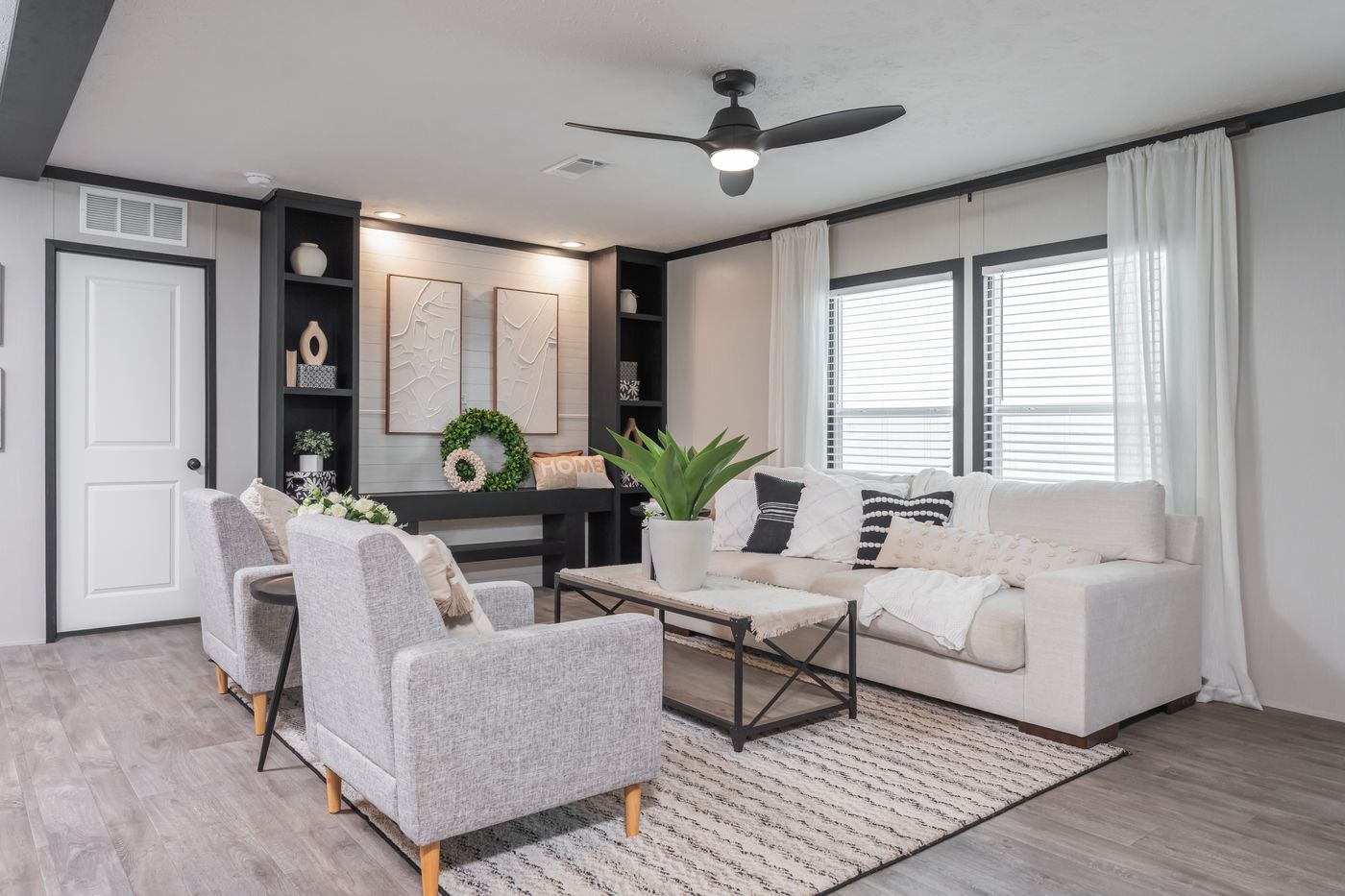 The CRAZY EIGHTS Living Room. This Manufactured Mobile Home features 4 bedrooms and 2 baths.