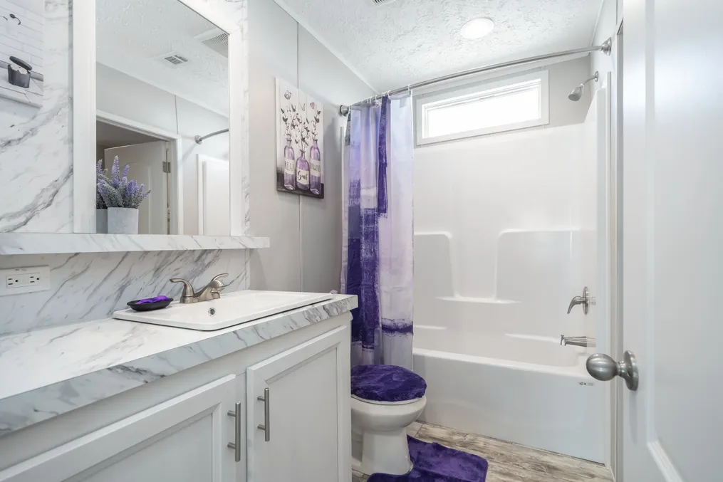 The STELLA Guest Bathroom. This Manufactured Mobile Home features 3 bedrooms and 2 baths.
