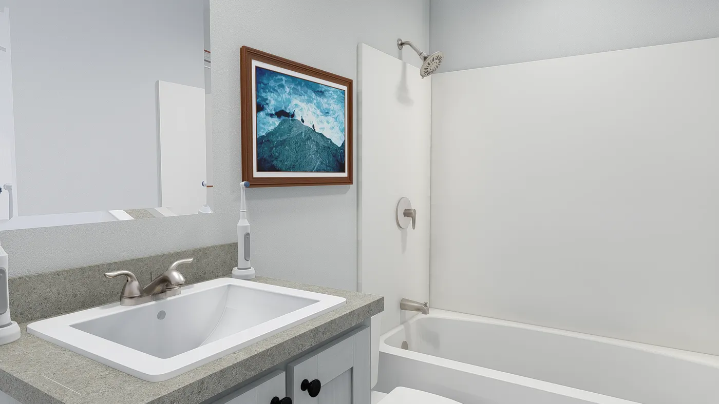 The HERE COMES THE SUN 4824 TEMPO Guest Bathroom. This Manufactured Mobile Home features 3 bedrooms and 2 baths.