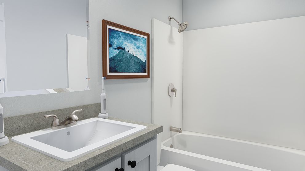 The HERE COMES THE SUN 4824 TEMPO Guest Bathroom. This Manufactured Mobile Home features 3 bedrooms and 2 baths.