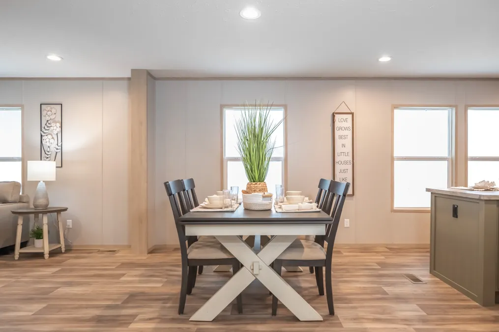 The RAINIER Dining Area. This Manufactured Mobile Home features 4 bedrooms and 3 baths.
