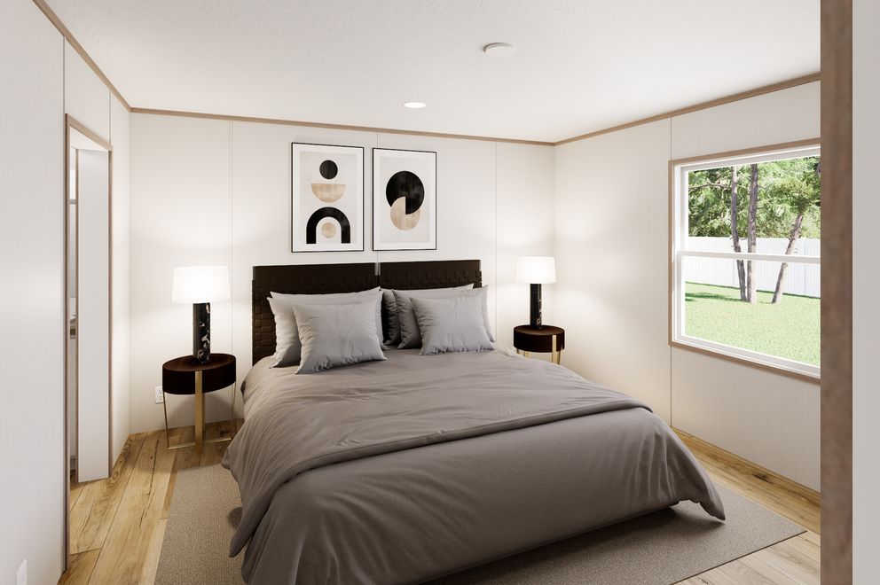 The ULTRA FLEX Primary Bedroom. This Manufactured Mobile Home features 3 bedrooms and 2 baths.