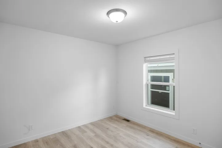 The LULAMAE 3 Guest Bedroom. This Manufactured Mobile Home features 3 bedrooms and 2 baths.