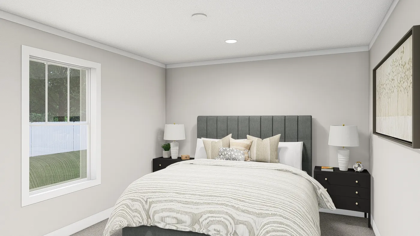 The HERE COMES THE SUN Primary Bedroom. This Manufactured Mobile Home features 3 bedrooms and 2 baths.