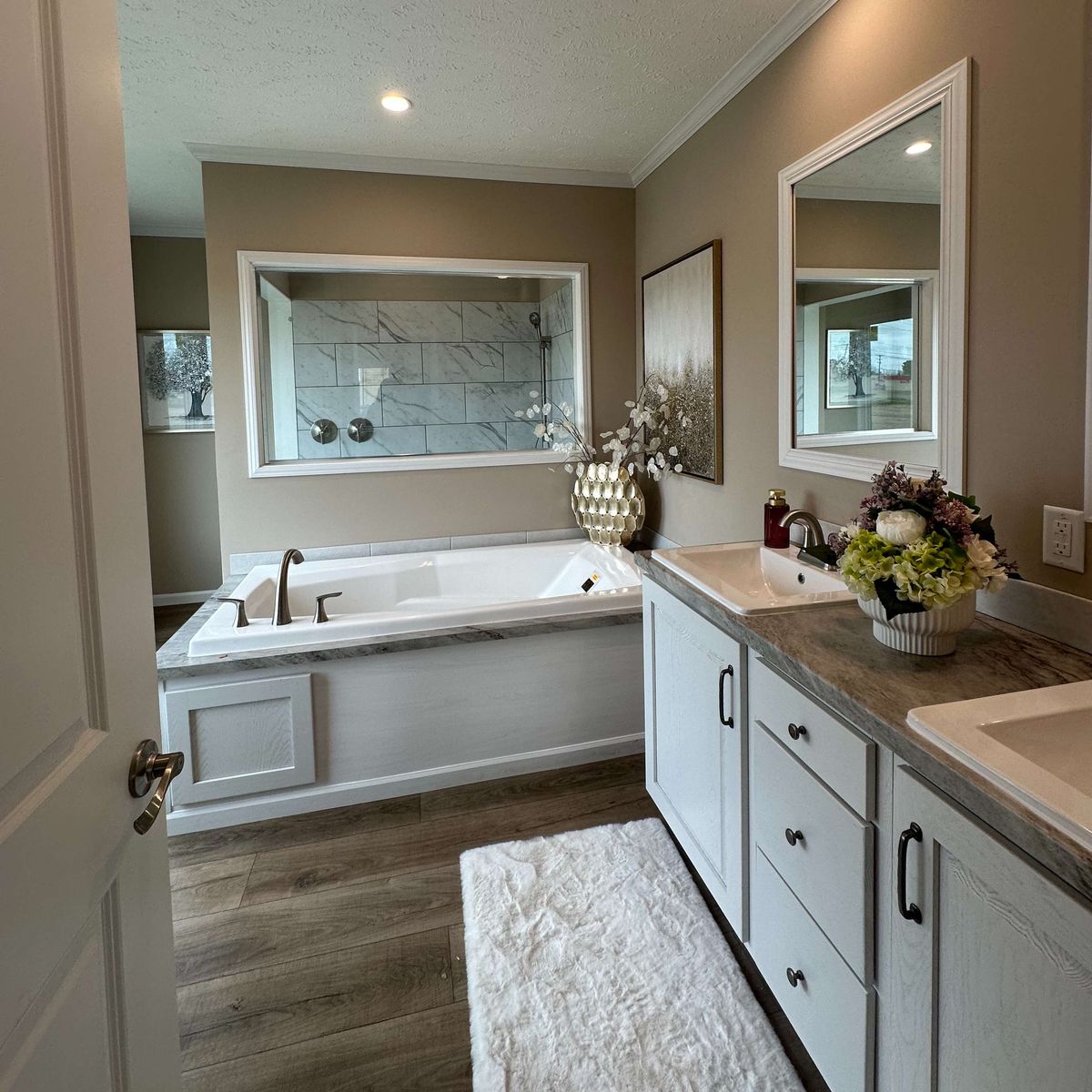 The THE HEXAGON Primary Bathroom. This Manufactured Mobile Home features 4 bedrooms and 3 baths.