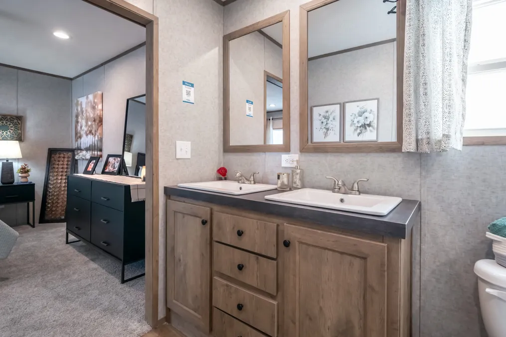 The THE WARRIOR Primary Bathroom. This Manufactured Mobile Home features 2 bedrooms and 2 baths.