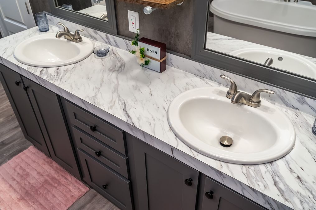 The THE FUSION 32B Primary Bathroom. This Manufactured Mobile Home features 4 bedrooms and 2 baths.