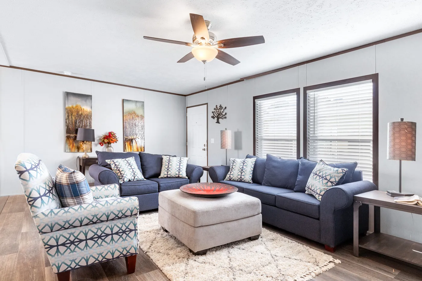 The THE SUNDOWNER Living Room. This Manufactured Mobile Home features 3 bedrooms and 2 baths.