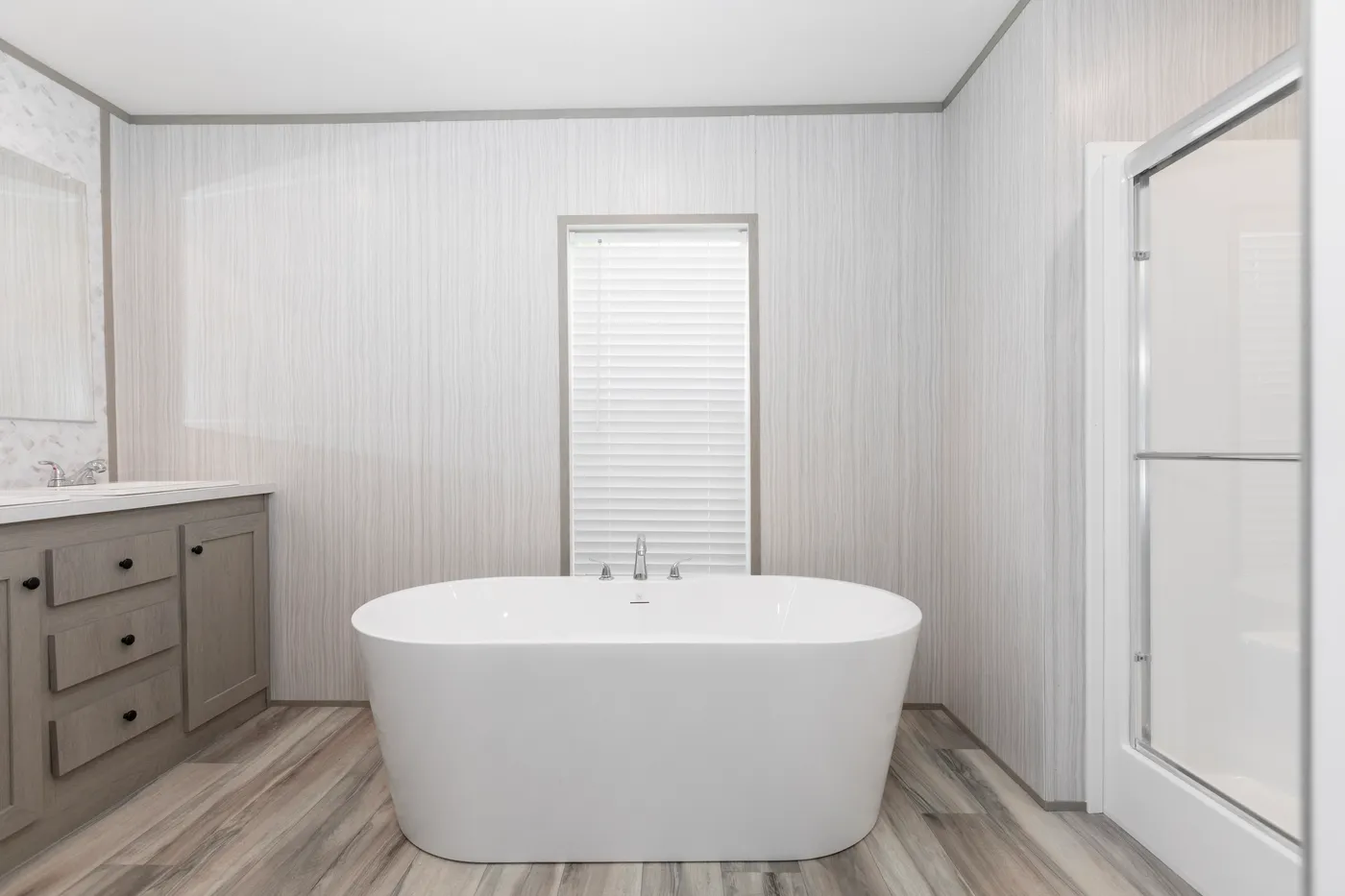 The THE OLYMPUS Primary Bathroom. This Manufactured Mobile Home features 3 bedrooms and 2 baths.