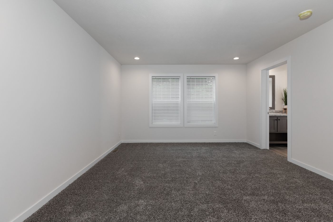 The PIONEER ST 6030-MS064 SECT Primary Bedroom. This Manufactured Mobile Home features 3 bedrooms and 2 baths.