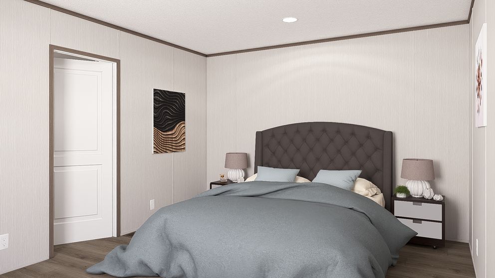 The LEGEND ANNIVERSARY 16X76 Primary Bedroom. This Manufactured Mobile Home features 3 bedrooms and 2 baths.