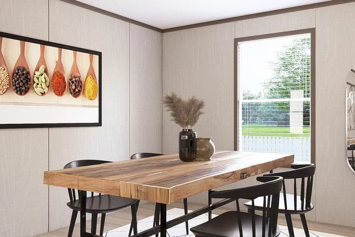 The THE RESERVE 60 Dining Area. This Manufactured Mobile Home features 3 bedrooms and 2 baths.