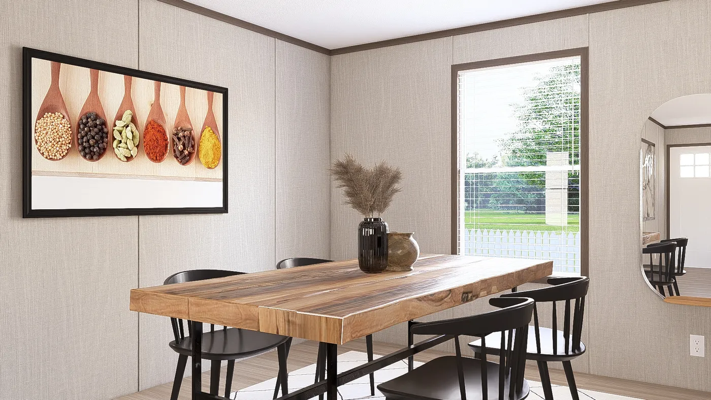 The THE RESERVE 60 Dining Area. This Manufactured Mobile Home features 3 bedrooms and 2 baths.
