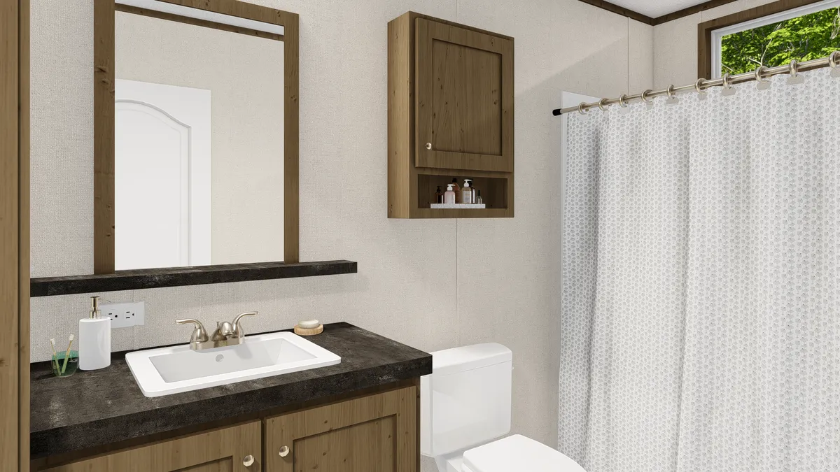 The GRAND LIVING 64 Guest Bathroom. This Manufactured Mobile Home features 3 bedrooms and 2 baths.