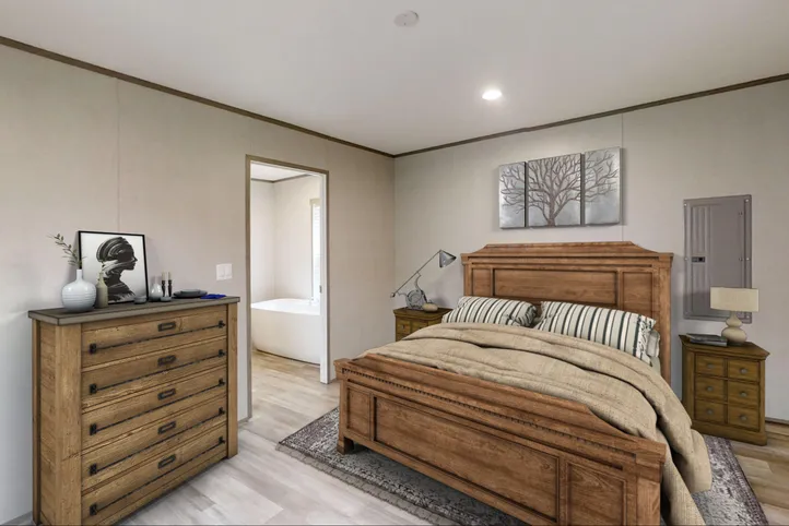 The THE POWERHOUSE Primary Bedroom. This Manufactured Mobile Home features 3 bedrooms and 2 baths.