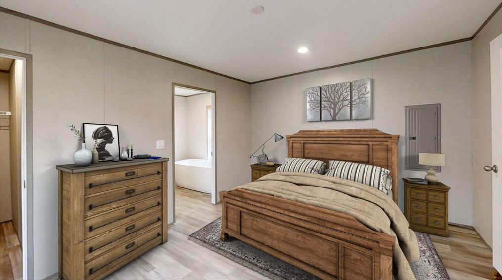 The THE POWERHOUSE Primary Bedroom. This Manufactured Mobile Home features 3 bedrooms and 2 baths.