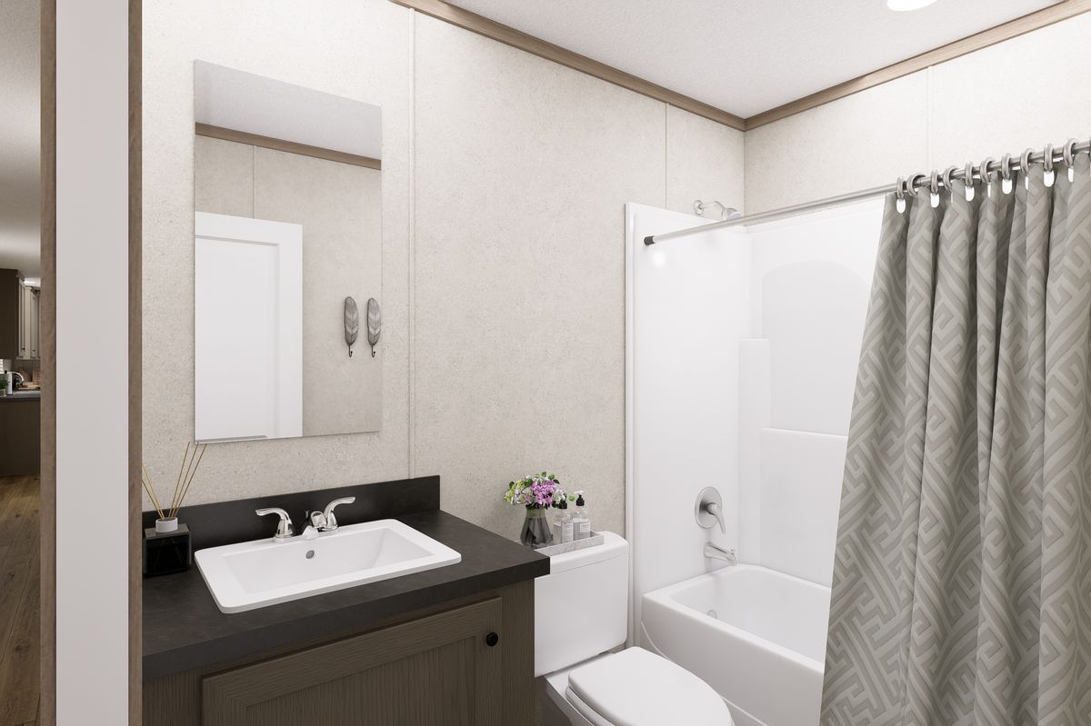 The 7616-CC01 CORNERSTONE 76 Guest Bathroom. This Manufactured Mobile Home features 3 bedrooms and 2 baths.