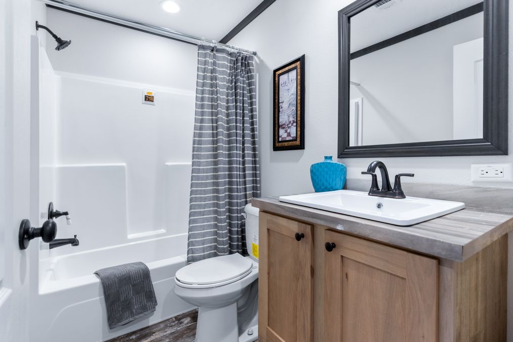 The BOUJEE XL Guest Bathroom. This Manufactured Mobile Home features 4 bedrooms and 3 baths.