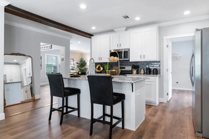 The THE CHANEL Kitchen. This Manufactured Mobile Home features 4 bedrooms and 3 baths.