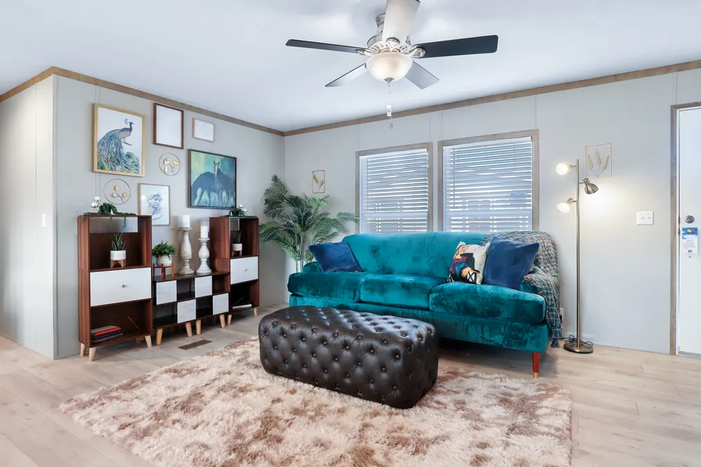 The BLUEBONNET BREEZE Living Room. This Manufactured Mobile Home features 3 bedrooms and 2 baths.
