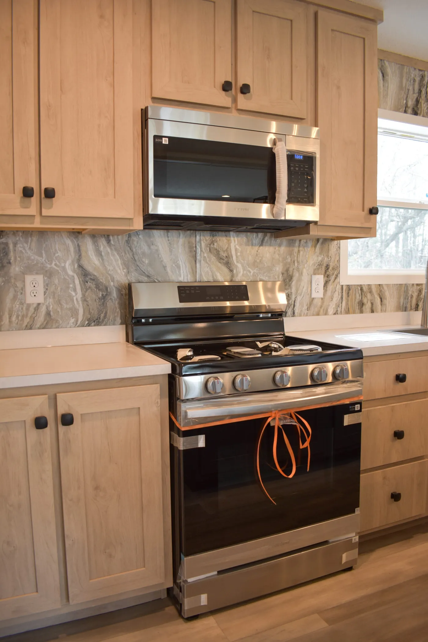 The MOONSTONE 60 Kitchen. This Manufactured Mobile Home features 3 bedrooms and 2 baths.