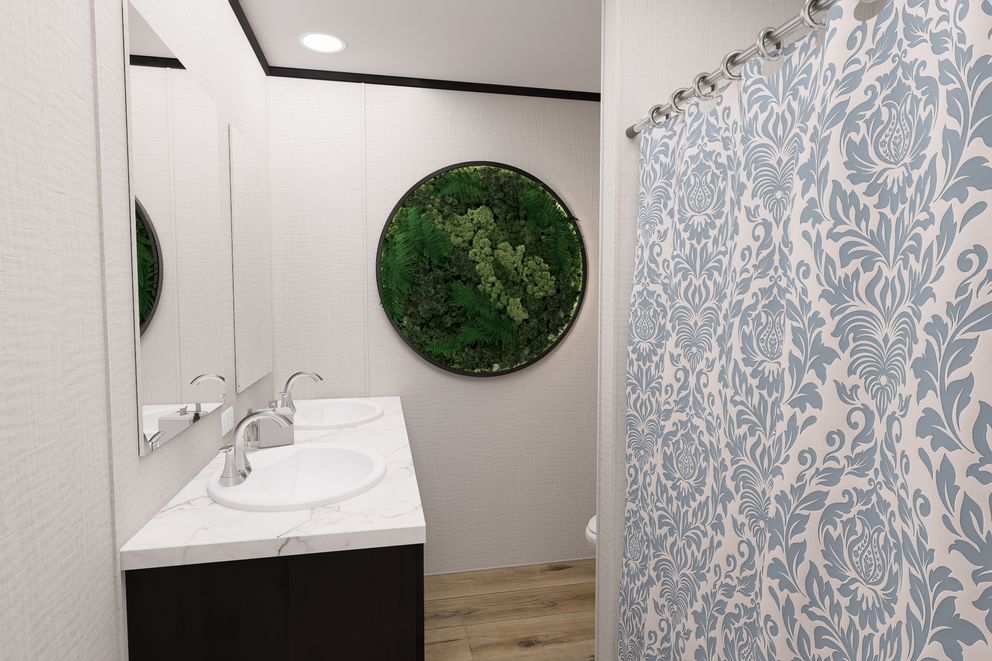 The ULTRA FLEX Guest Bathroom. This Manufactured Mobile Home features 3 bedrooms and 2 baths.