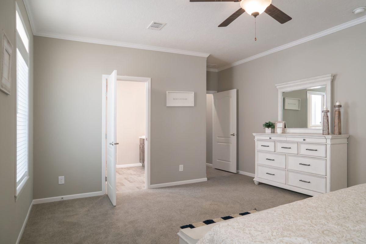 The HUXTON II Master Bedroom. This Manufactured Mobile Home features 4 bedrooms and 2 baths.