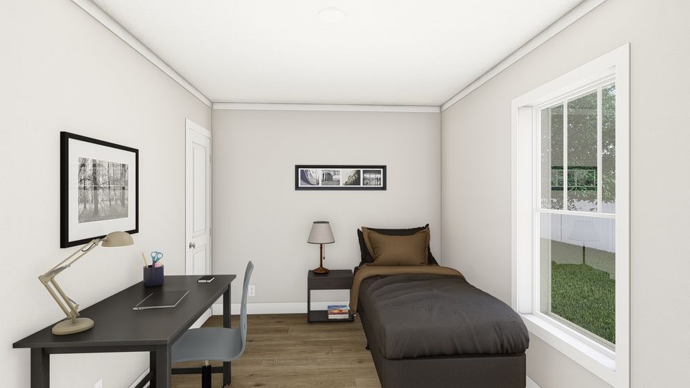 The SWEET CAROLINE Guest Bedroom. This Manufactured Mobile Home features 3 bedrooms and 2 baths.