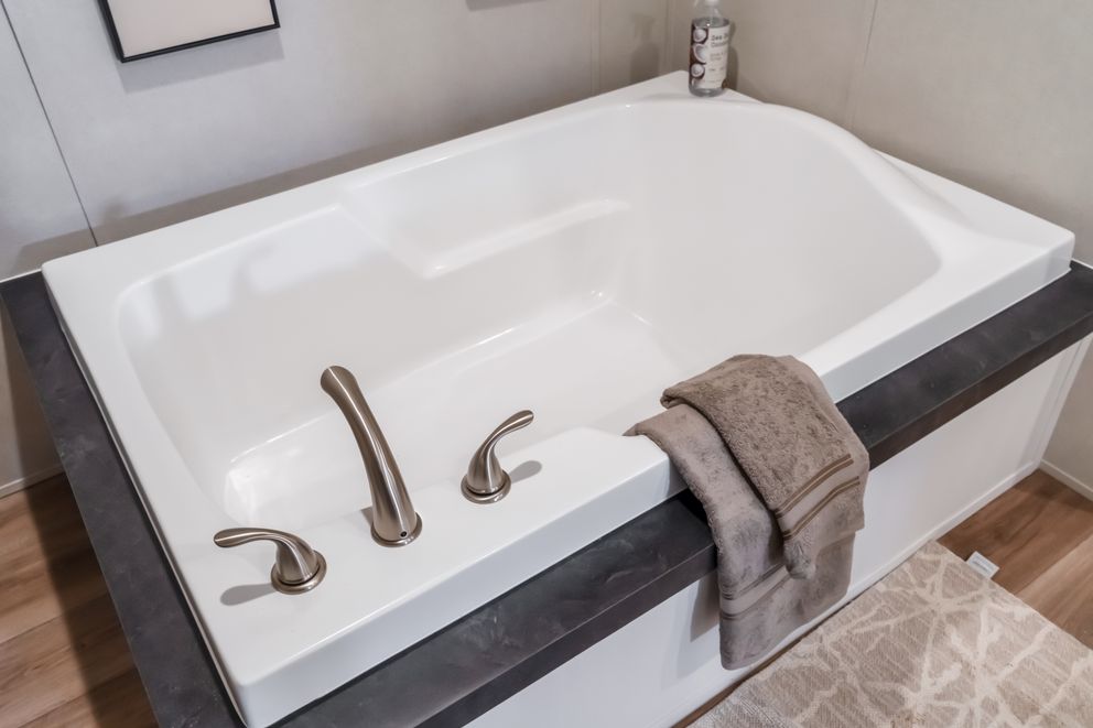The ECLIPSE Primary Bathroom. This Manufactured Mobile Home features 4 bedrooms and 2 baths.