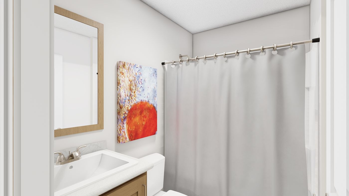 The RAMSEY 218-1 Guest Bathroom. This Manufactured Mobile Home features 3 bedrooms and 2 baths.