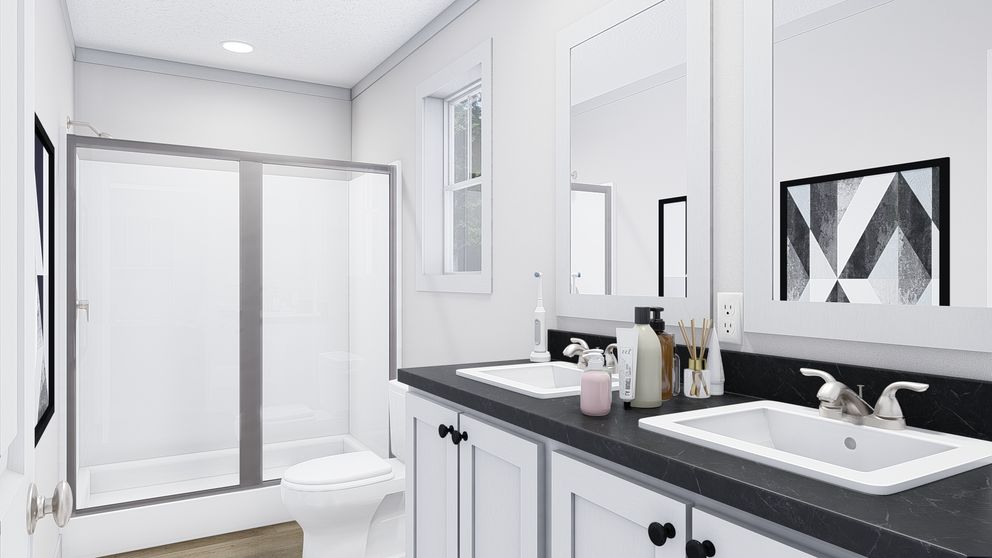 The JOHNNY B GOODE Primary Bathroom. This Manufactured Mobile Home features 3 bedrooms and 2 baths.