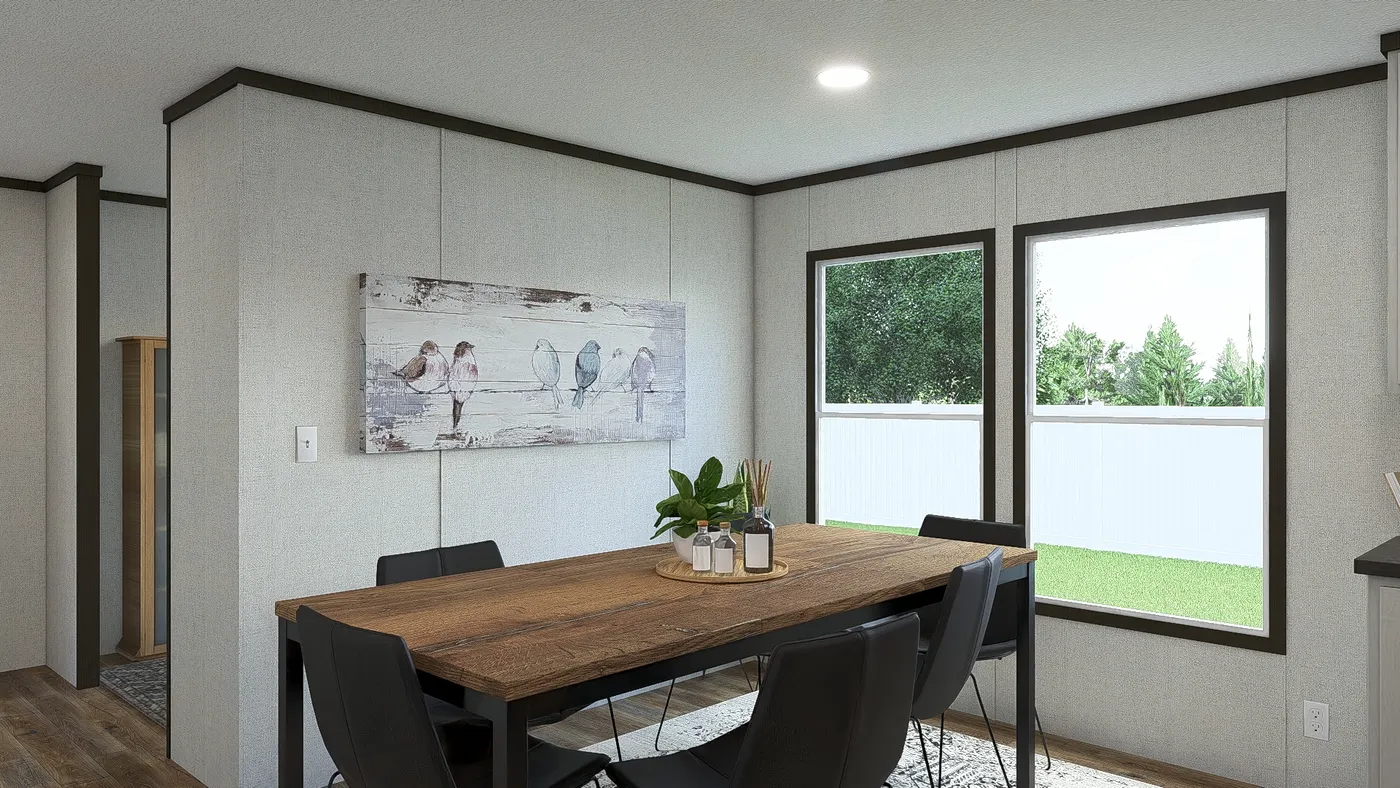 The IMPACT Dining Area. This Manufactured Mobile Home features 4 bedrooms and 2 baths.