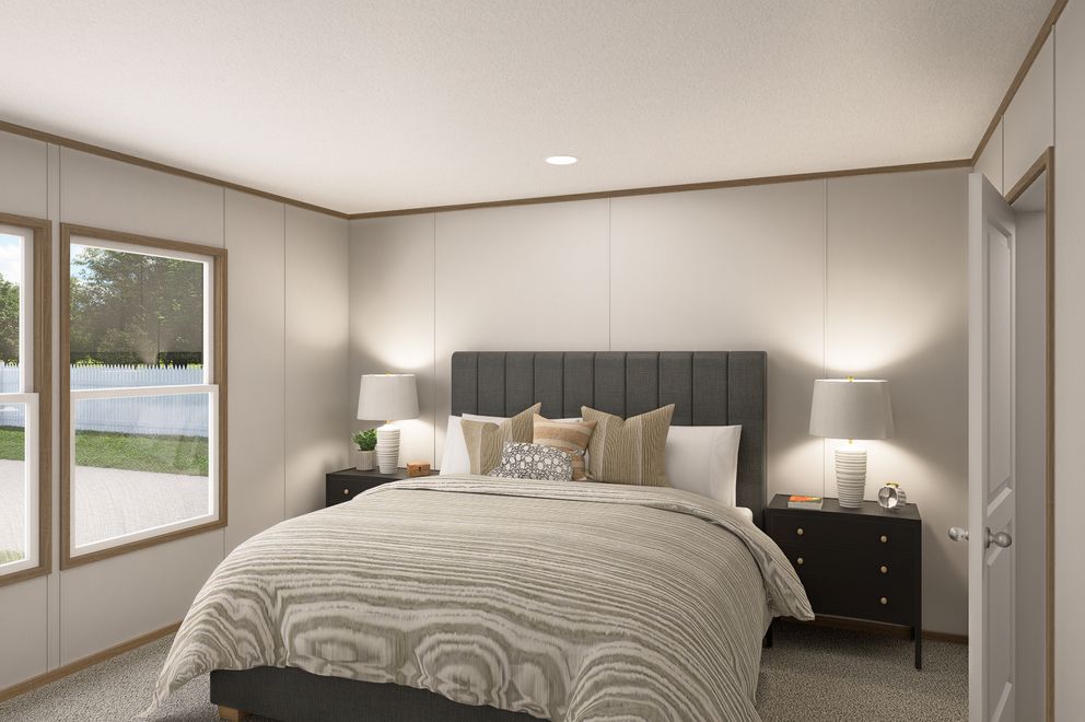 The THE EAGLE 52 Primary Bedroom. This Manufactured Mobile Home features 3 bedrooms and 2 baths.